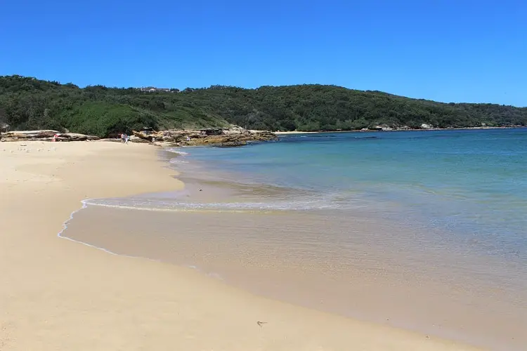 Congwong Beach in Sydney on a lovely sunny day with clear water rolling in.