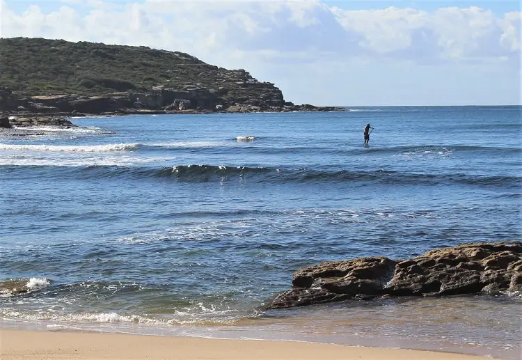 Man paddle boarding at Malabar, Sydney.