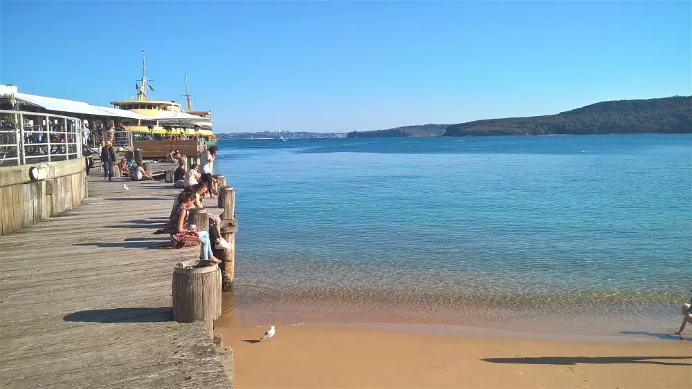 Still water at the wharf and the Manly ferry.