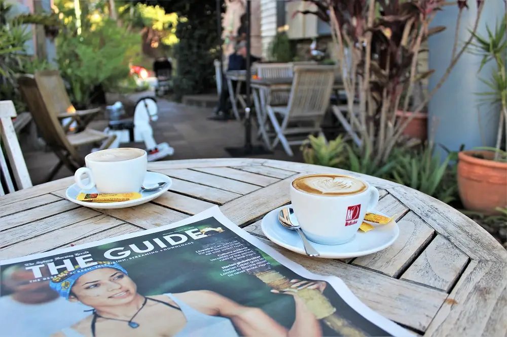 Coffee and newspapers at Bellingen Gelato cafe.
