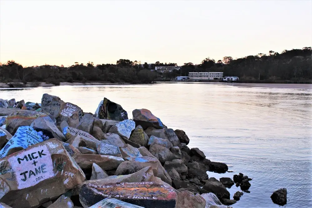 Painted break wall at Nambucca Heads, NSW at sunset.