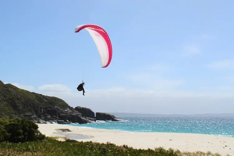 A handglider landing on Shelley Beach in Western Australia.