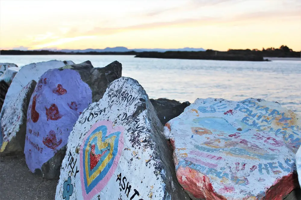 Painted rocks at Port Macquarie breakwall.