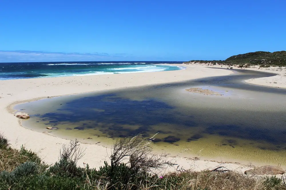 Looking down on the beach and swirling water at Rivermouth, Margaret River, WA.