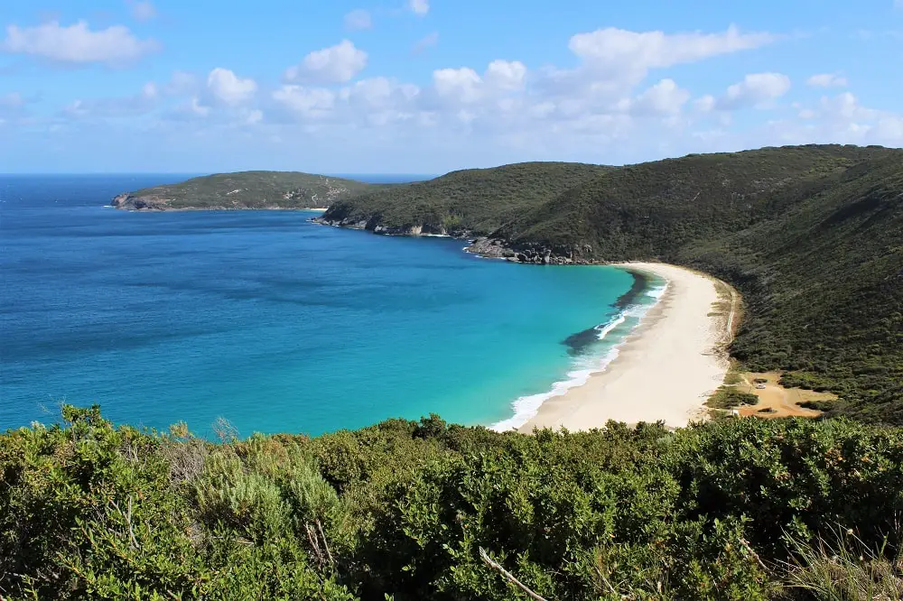 Looking down on the free camping ground, Shelley Beach, in Western Australia. This beautiful spot with white sand and turquoise ocean is the perfect overnight stop on an Adelaide to Perth road trip.