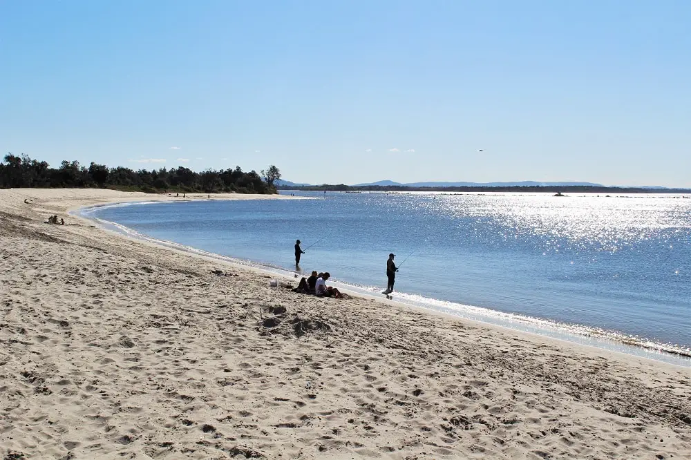 Fishermen at Whiting Beach, Yamba, New South Wales.