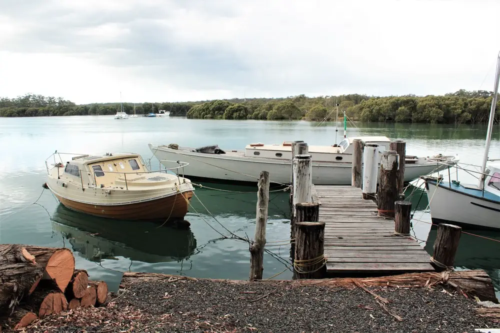 Boats and a pretty view across Currambene Creek near Woollamia Boat Ramp in Jervis Bay.