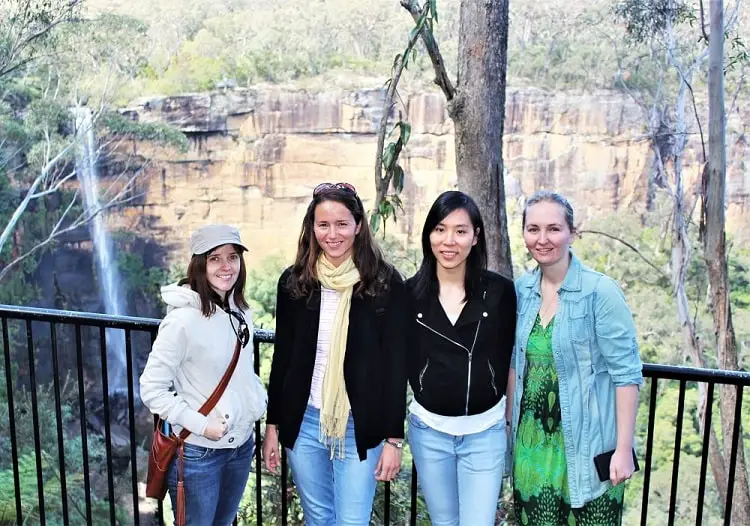Blogger Lisa Bull and friends, standing in front of Fitzroy Falls, New South Wales.