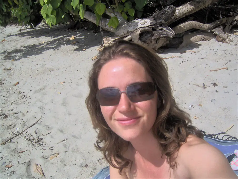 Lisa Bull, owner of Dreaming of Down Under travel blog, on a beach in Queensland.