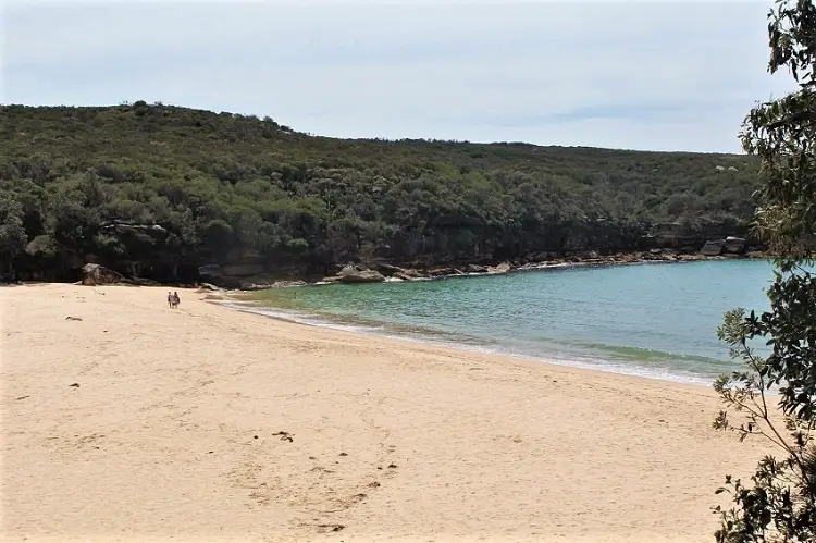 Couple on the beach at Wattamolla.