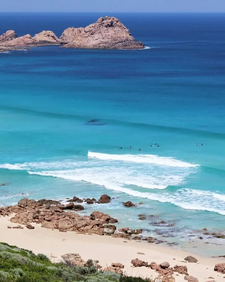 Amazing turquoise water and surfers viewed from the Cape to Cape walk in Yallingup.