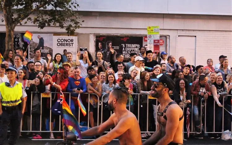 Topless men on a motorbike in the Sydney Gay and Lesbian Mardi Gras Parade.