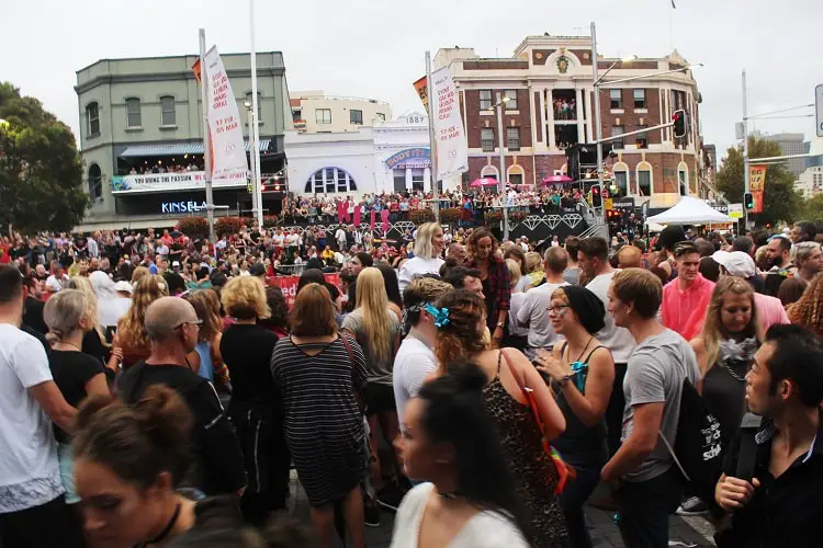 Visitors and locals waiting on Oxford Street at the start of Mardi Gras Sydney.