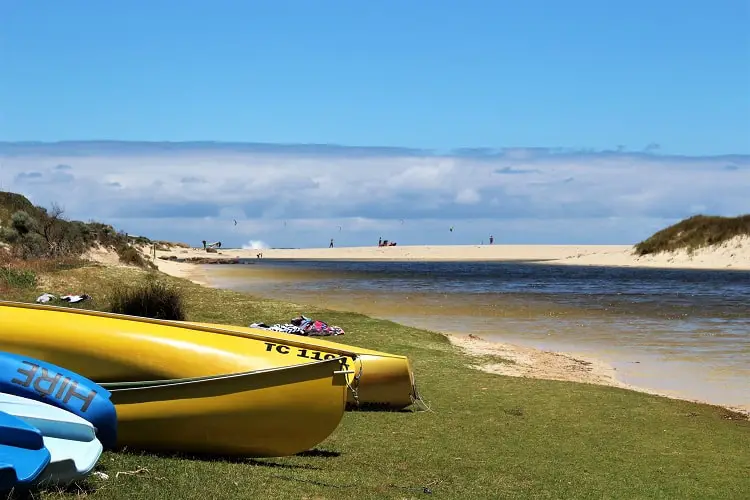 Colourful kayaks on the grass at Margaret River rivermouth.