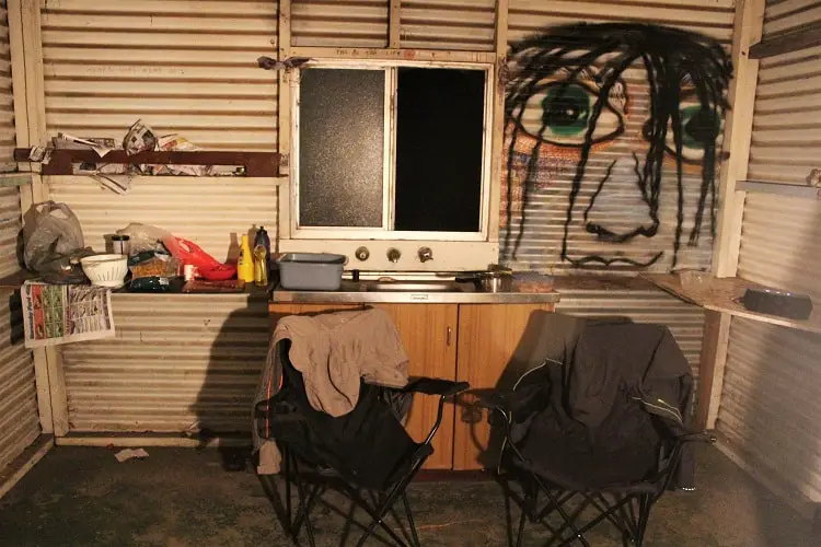 Inside a dirty old fisherman's hut at Betty's Beach in Western Australia, where you can free camp.