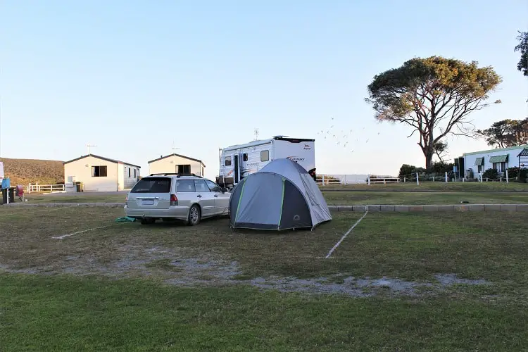 A tent and cabins at Rose Gardens holiday park at Emu Point, WA.