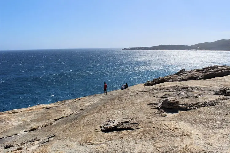 A traveller standing on the cliff edge at Albany blowholes.