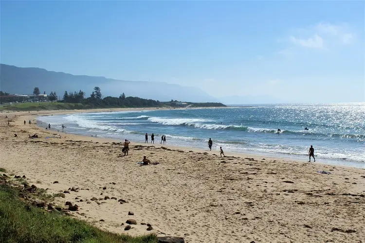 Sandon Point Beach viewed from the southern end near Bulli Beach Cafe on a sunny day.