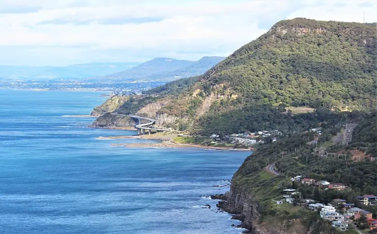View of the Sea Cliff Bridge and coastline from Bald Hill lookout, one of the most scenic short drives from Sydney along the Grand Pacific Drive.