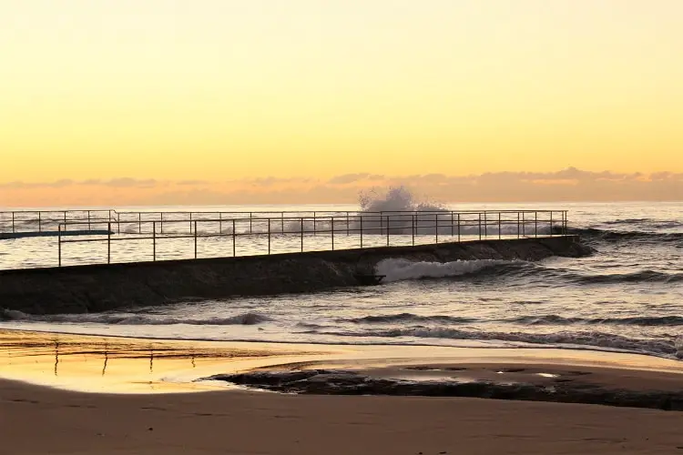 Crashing waves at dawn at Bulli ocean pool, NSW.