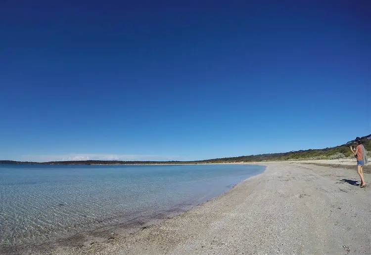 Blogger Lisa Bull photographing the beach below Fisherman Point in Lincoln National Park.