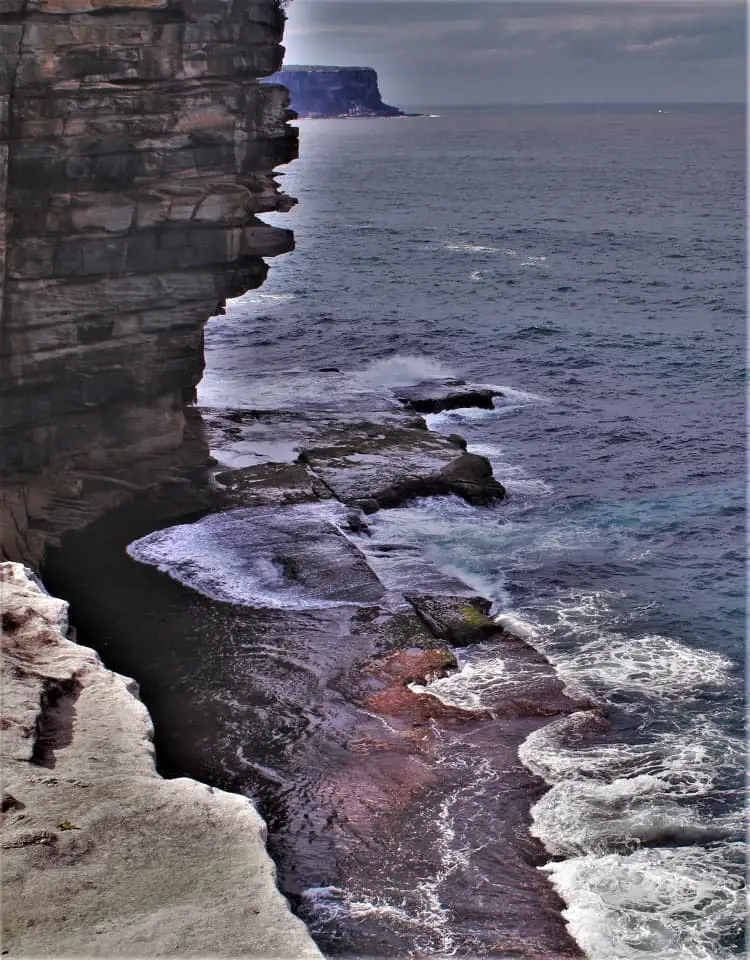 Amazing view down the cliffs onto crashing waves at top Sydney lookout: The Gap in Watsons Bay.