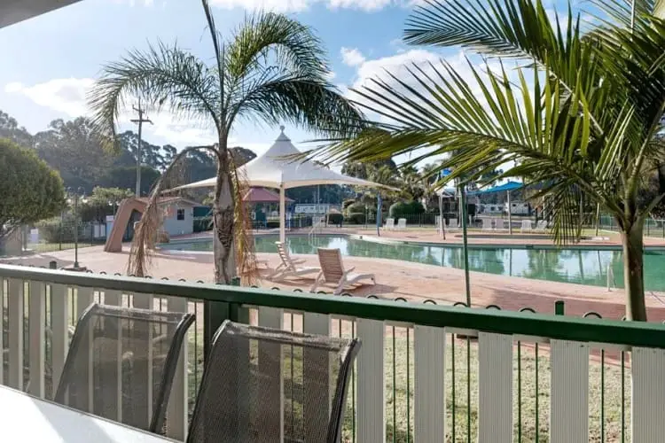 Swimming pool and verandah at Discovery Parks Eden.