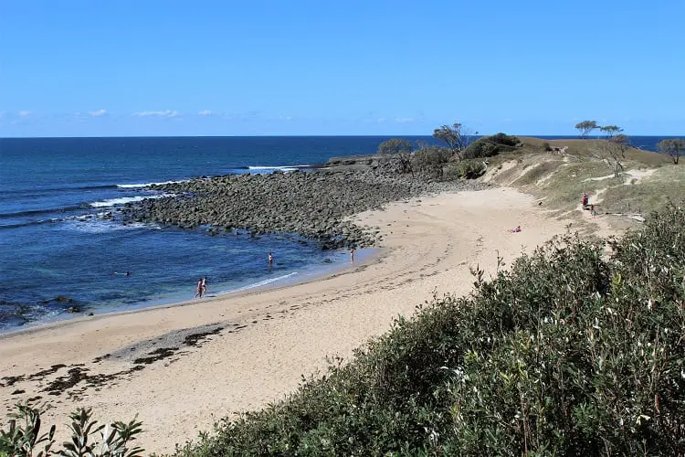 People on the beach at Angourie Point, NSW.