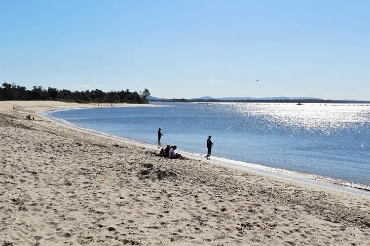 Fishermen at Whiting Beach, Yamba, NSW, Australia.