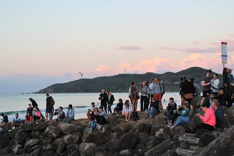 Gathering at The Wreck, Byron Bay, to watch the sunset.