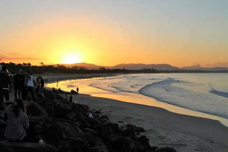 Crawos watching the sunset at Main Beach, Byron Bay.