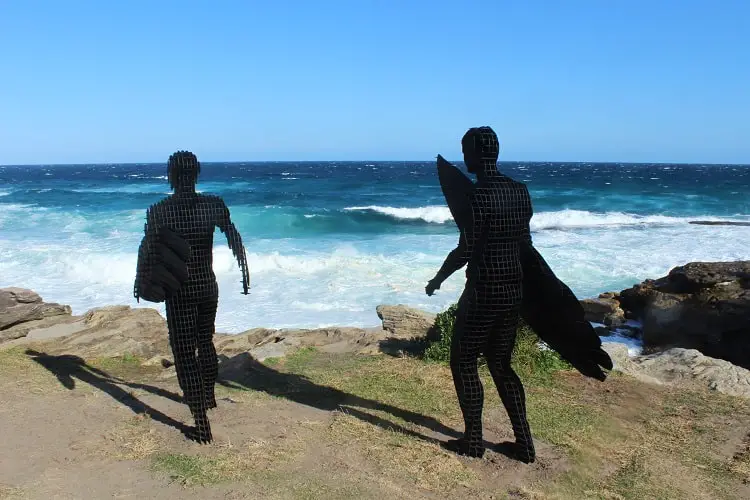 Surfer sculptures at Mackenzies Point at Sculptures by the Sea Sydney.
