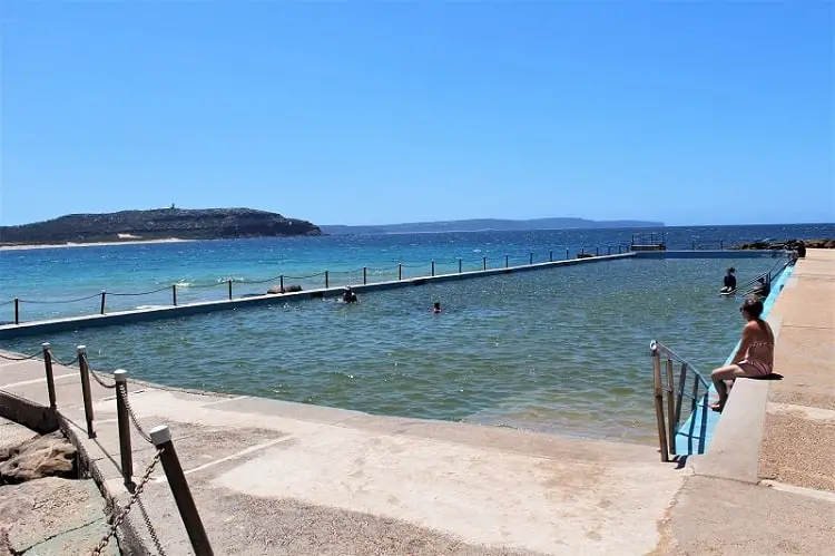 Swimmers at Palm Beach rock pool on a summer's day in Sydney.