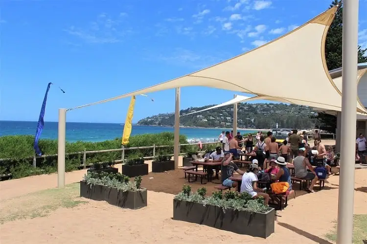 Diners outside Summer Bay Surf Club kiosk.