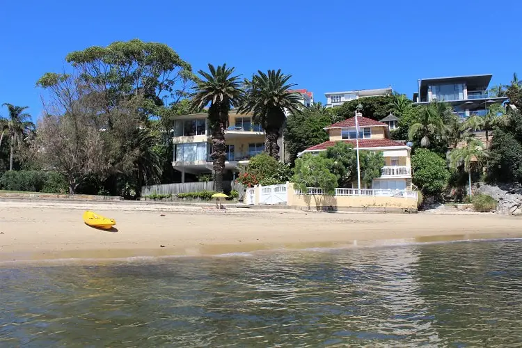 Gibsons Beach and waterfront mansions in Watsons Bay on a sunny day.