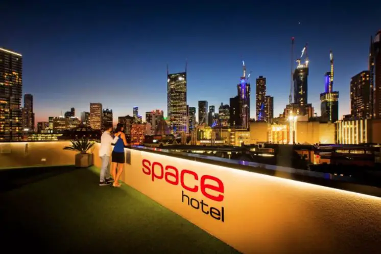 City skyline viewed at night from the terrace at Space Hotel, Melbourne.