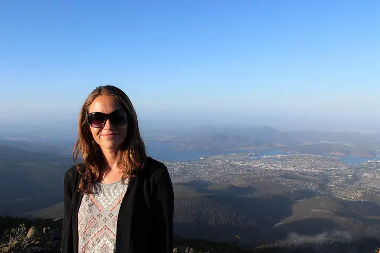 Female traveller at the summit of Mt Wellington.