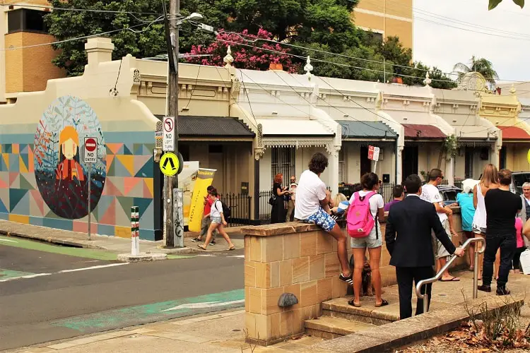 Sydneysiders at a property auction for a tiny home in Newtown that sold for over $1 million.