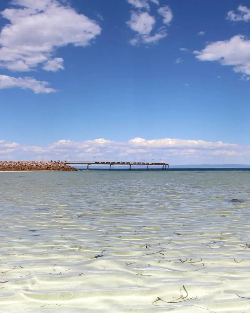 Whyalla jetty viewed across clear water.