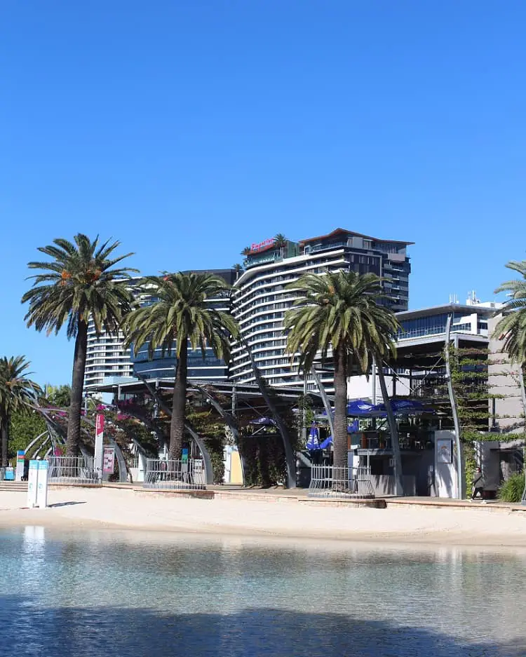 South Bank lagoon and beach in Brisbane on a sunny day. Learn about Beaches in Brisbane vs Perth.