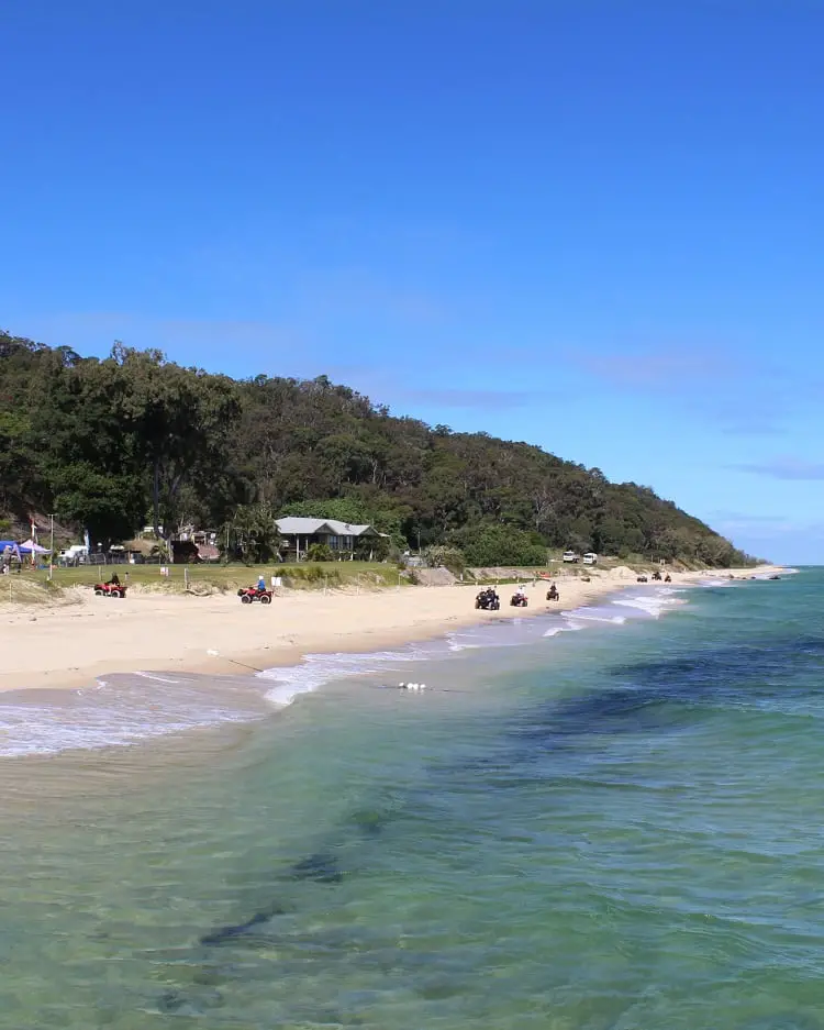 Quad bikes on the beach at Moreton Island, Queensland. This is a top holiday destination in Brisbane.