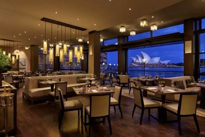 View of Sydney Opera House and the onsite restaurant at Park Hyatt Sydney, a luxury 5-start hotel.
