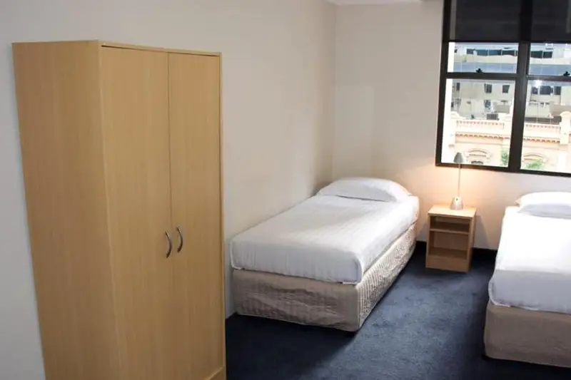 A basic twin room inside budget accommodation, Siesta Sydney.