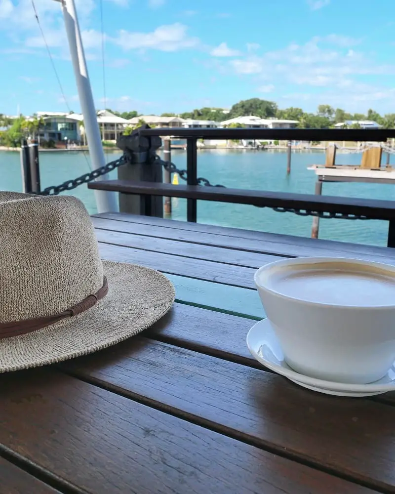 Cup of coffee on a bench at Cullen Bay.