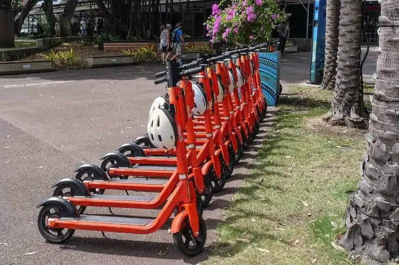 A row of Neuron hire scooters in Darwin.