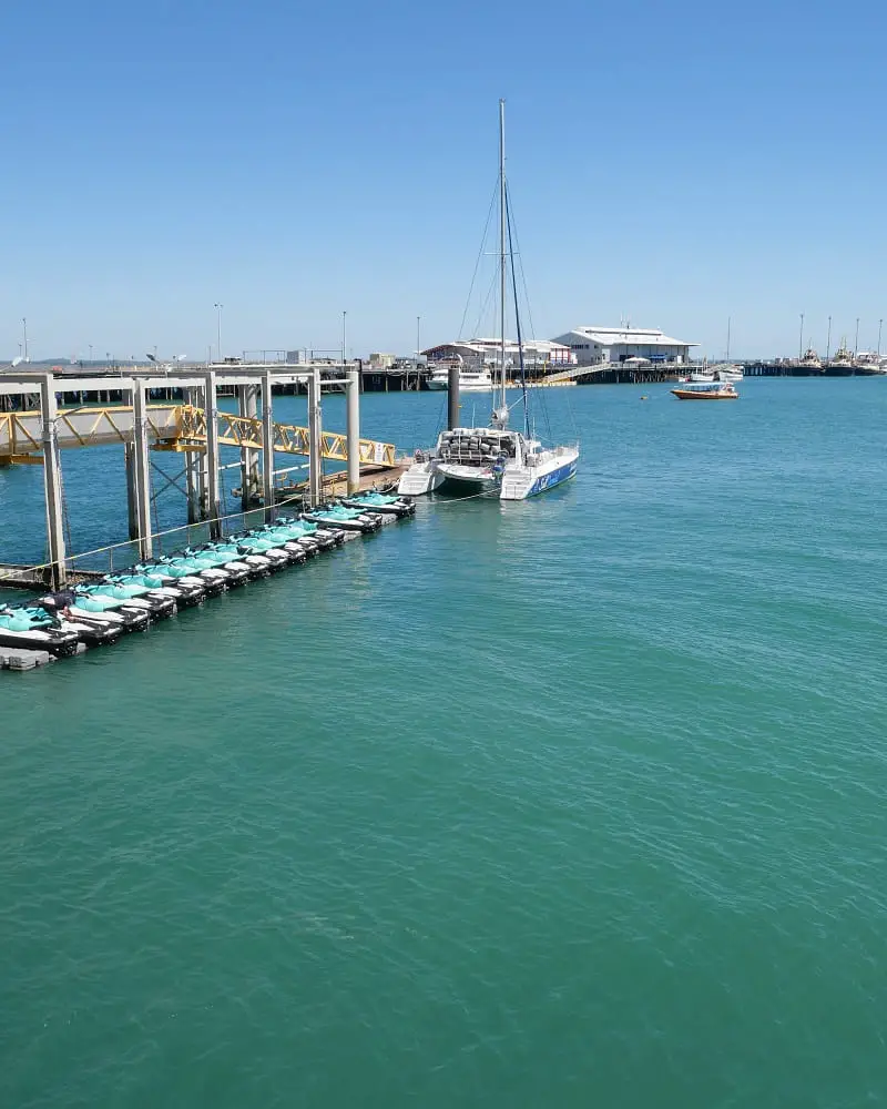 Jet skis lined up in Darwin Harbour with Stoked Hill Wharf in the background.