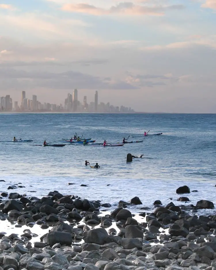 A group of people kayaking at Burleigh Heads, Gold Coast in Australia.