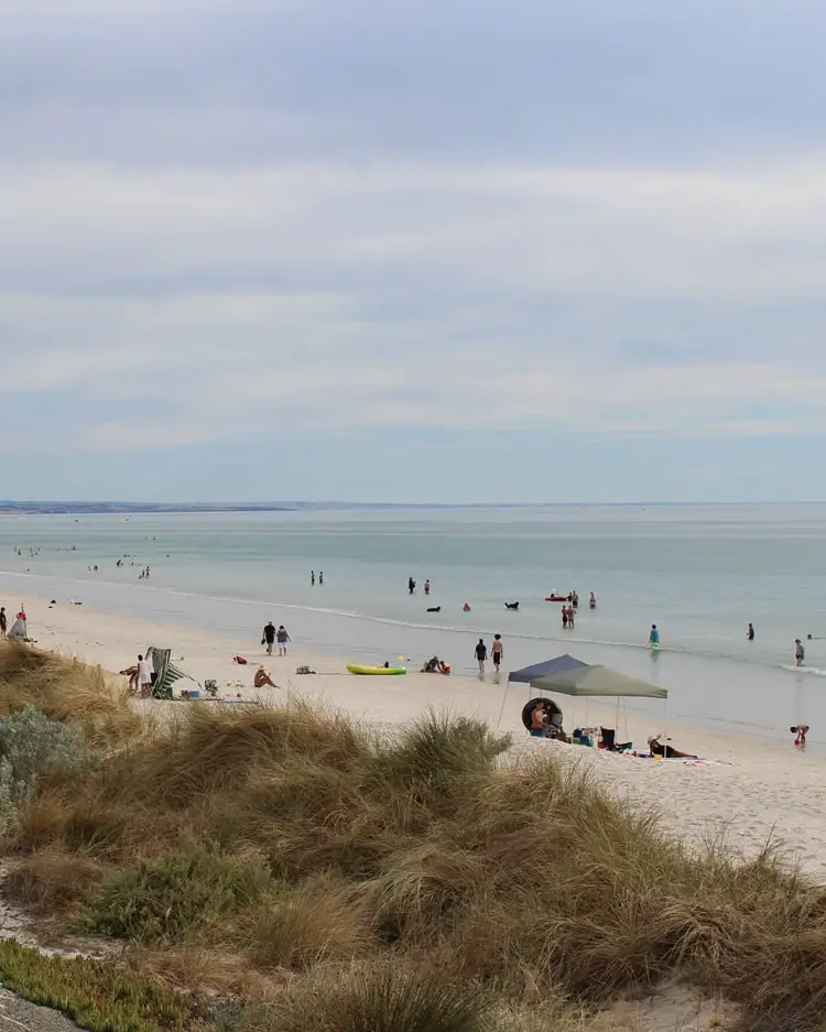 People on Henley Beach in Adelaide, South Australia.